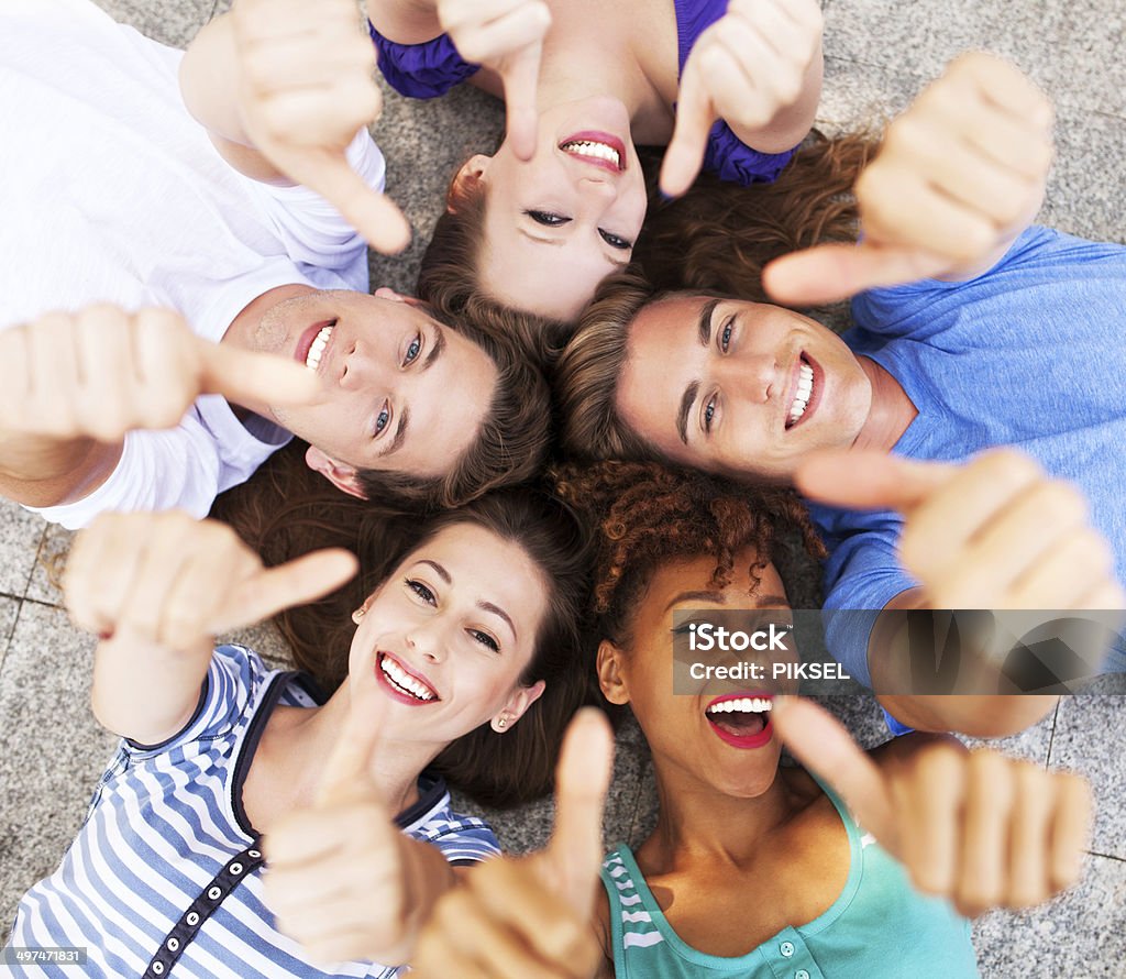 Friends showing thumbs up Circle Stock Photo