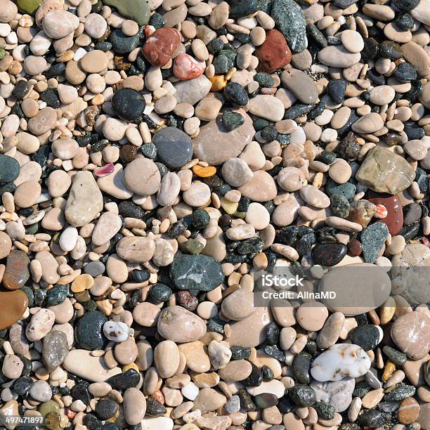 Background Of Natural Stone Pebbles Stock Photo - Download Image Now - Backgrounds, Beach, Black Color