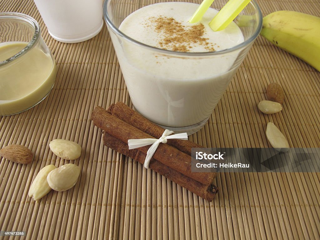 Milk shake with banana and almond butter Milk shake with banana and almond butter - Milchshake mit Banane und Mandelmus Almond Stock Photo