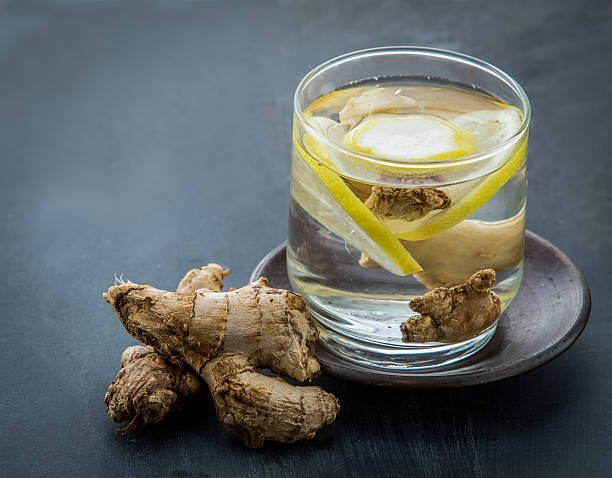 infused water mix of ginger and lemon Summer fresh fruit Flavored infused water mix of ginger and lemon infused water stock pictures, royalty-free photos & images