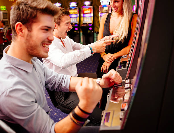istock Group of Friend Playing with Slot Machines 497481712