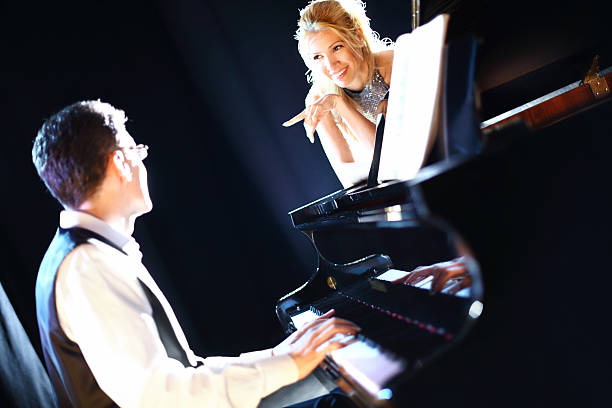 istock Pianist and singer in a concert. 497481734
