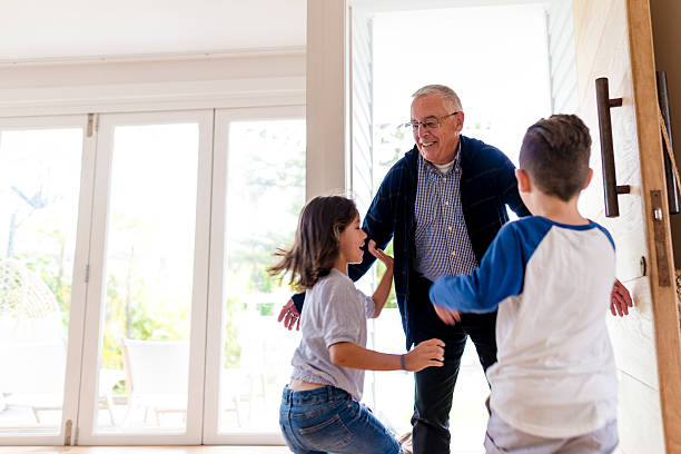 istock Grandfather greeting his children 497481882