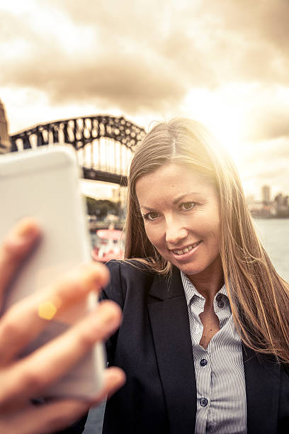 istock Woman taking a selfie in Sydney Harbor 497482582