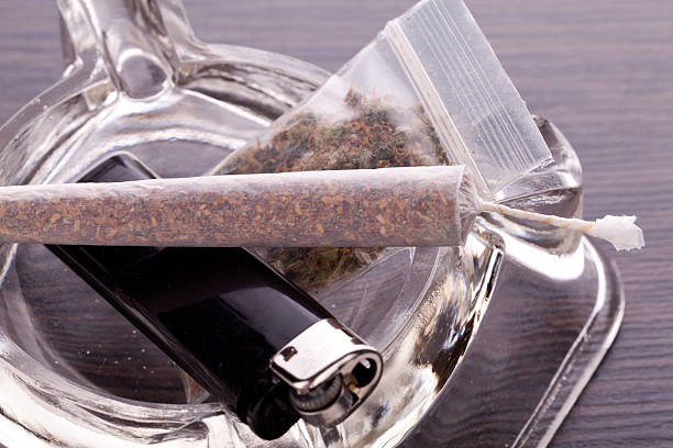 istock Close up of marijuana and smoking paraphernalia 497483024