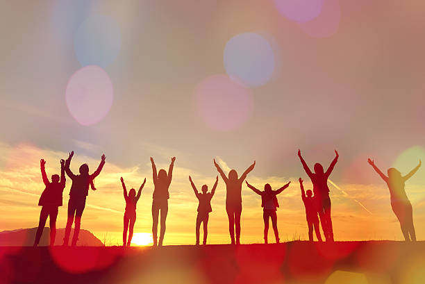 istock friends silhouettes at sunset 497483616