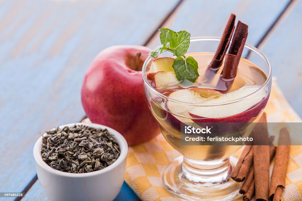 infused water mix of green tea, cinnamon and apple Summer fresh fruit Flavored infused water mix of green tea, cinnamon, and apple Cinnamon Stock Photo