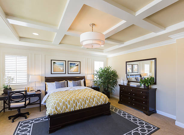 Interior of A Beautiful Master Bedroom Dramatic Interior of A Beautiful Master Bedroom. owners bedroom stock pictures, royalty-free photos & images