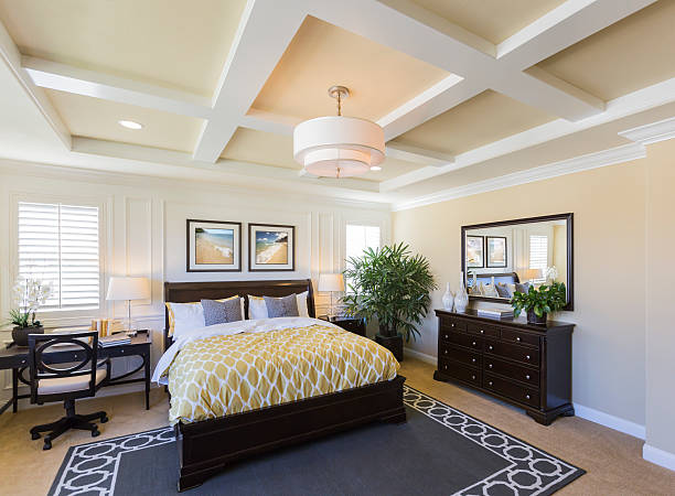 Interior of A Beautiful Master Bedroom Dramatic Interior of A Beautiful Master Bedroom. shutter furniture stock pictures, royalty-free photos & images