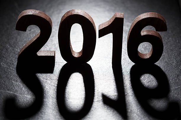 istock Happy New Year 2016 back lit wooden letters 497486092