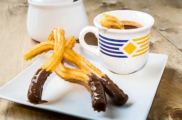 istock Churros with hot chocolate and sugar 497486800