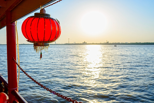 Songhua River and Chinese lantern at dusk. Taken from a pleasure boat in Songhua River. Located in district of Daoli, Harbin City, Heilongjiang Province, China.