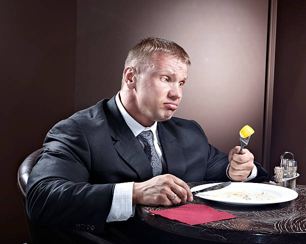 istock Muscular businessman eating 497488698