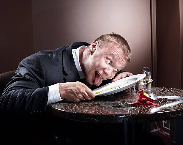 Muscular businessman eating