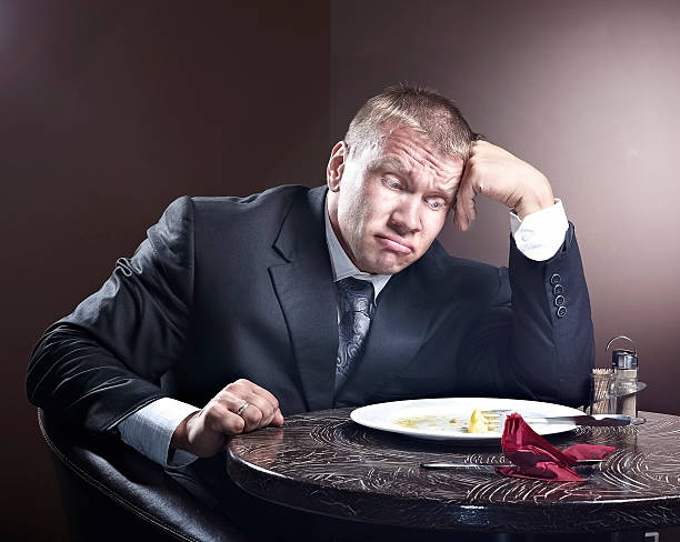 istock Muscular businessman eating 497488740