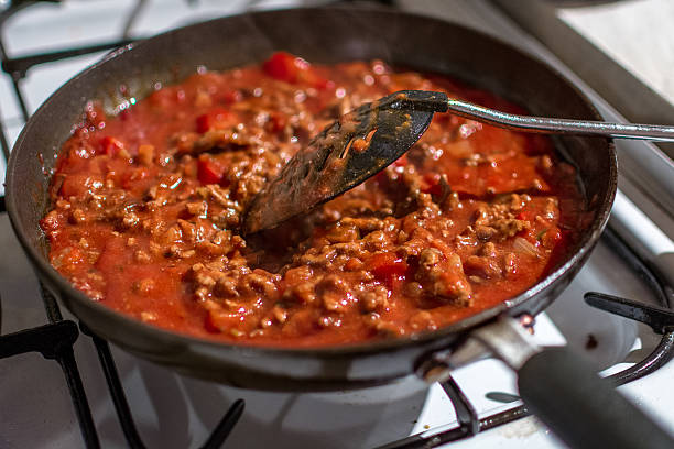 istock Cooked Minced Meat In Bolognese Tomato Sauce. 497489206