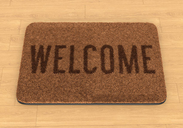 istock Welcome mat on wooden floor 497489899