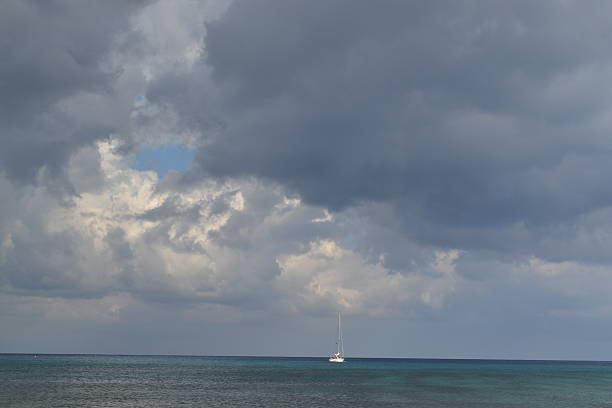 istock stormy sky with boat on the sea 497490337
