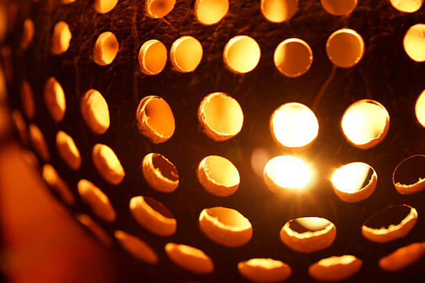 istock Closeup Carved and Perforated Coconut Lamp 497490427
