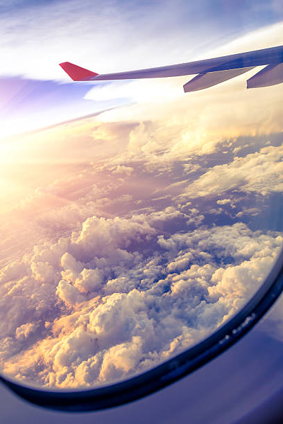 istock Clouds and sky as seen through window of an aircraft 497491239