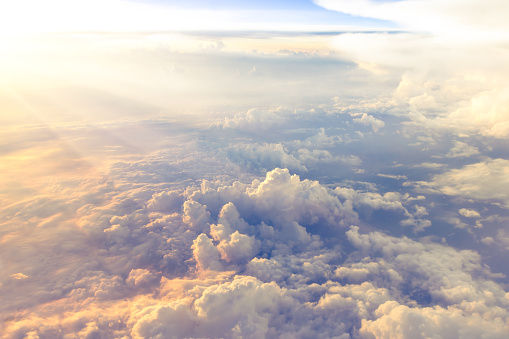 Clouds and sky as seen through window of an aircraft