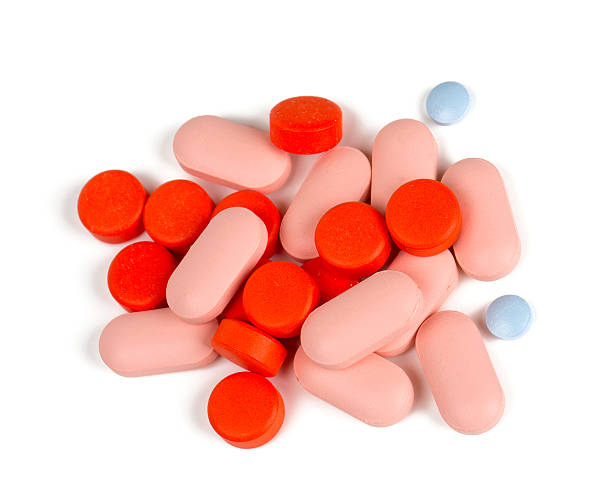 istock pile of different pills isolated on white 497492126