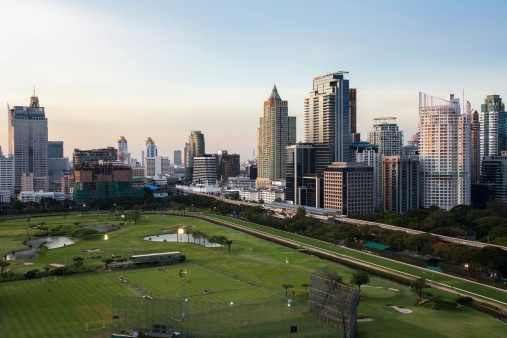 Bangkok Cityscape, Business district with Football Field at dusk (Thailand)