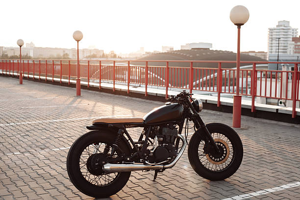 istock Vintage motorcycle in parking lot during sunset 497492380