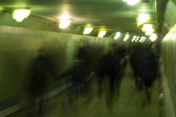 istock Motion blurred people walking in subway station. 497492503