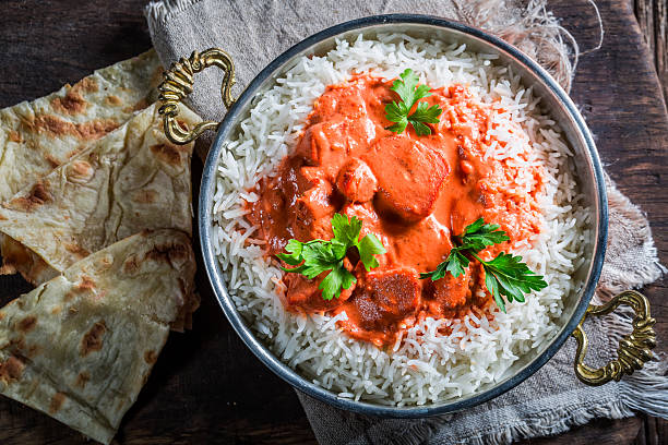 istock Indian tikka masala with rice and tomato sauce 497492726