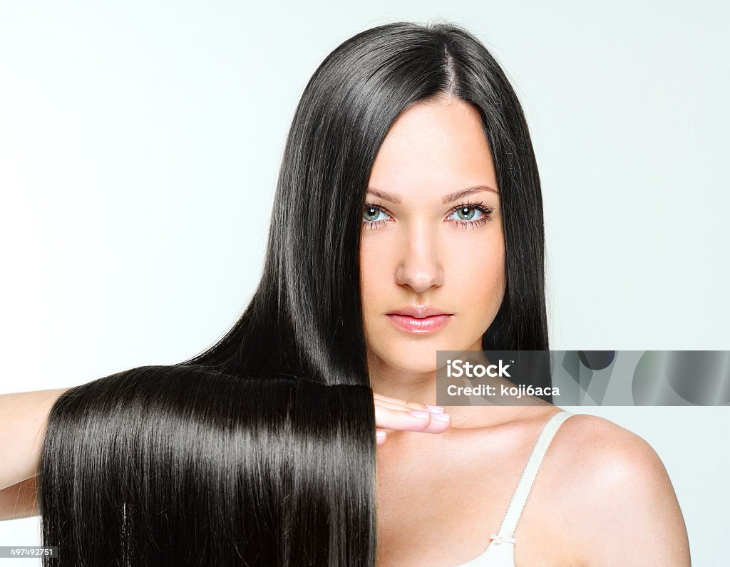 Beautiful Woman with Healthy Long Hair studio shot of a young fashion model with long natural hair Black Hair Stock Photo