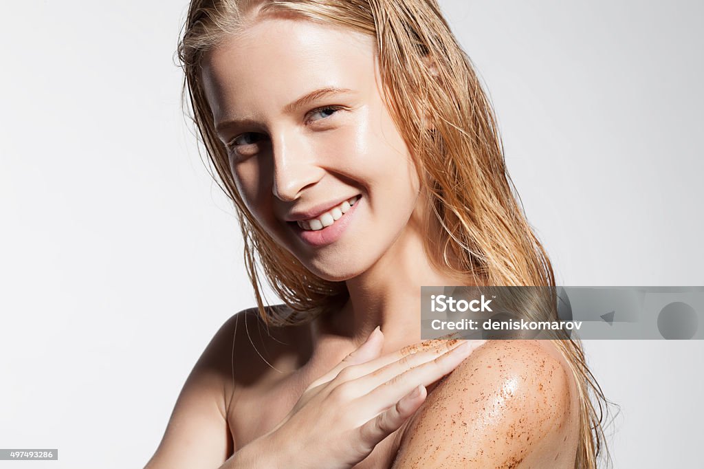 Woman exfoliates the skin cleansing scrub coffee Beautiful woman exfoliates the skin cleansing scrub coffee Exfoliation Stock Photo