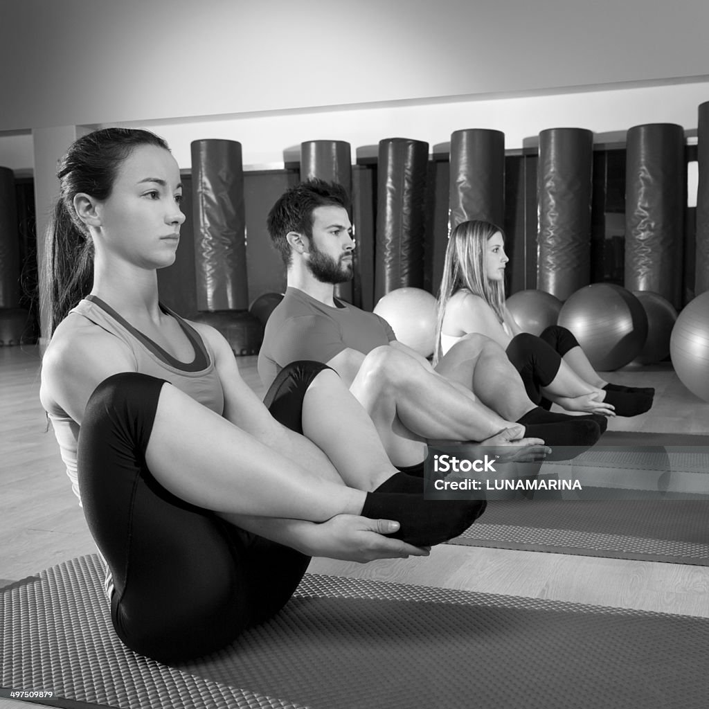 Pilates people group the seal exercise group Pilates people group the seal exercise man and women at fitness gym Activity Stock Photo