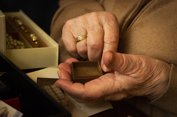 istock Old lady handling jewellery 497510371