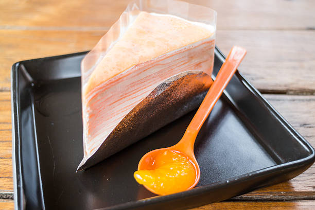 istock Light cream crepe cake with fresh orange 497510611