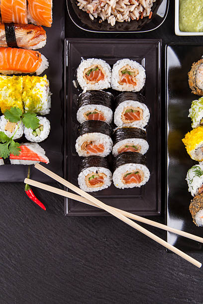 istock Delicious sushi pieces served on black stone 497510787