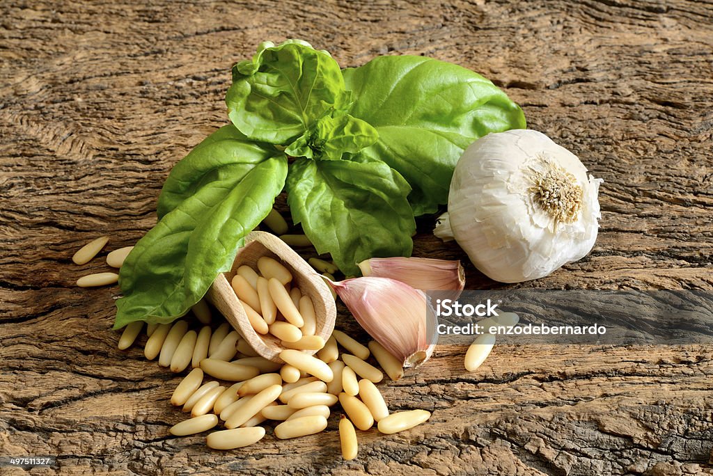 ingredients for pesto Genovese ingredients for pesto genovese sauce with garlic, fresh basil and pine nuts Basil Stock Photo