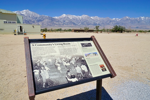 Lone Pine, California, USA - May 25, 2014: A sign at the Vistor Center to the Manzanar National Historic Site in California explains background of the camp. Manzanar was a relocation center where the US government under  President Franklin D Roosevelt ordered the incarceration of over 110,000 Japanese-Americans during World War II.