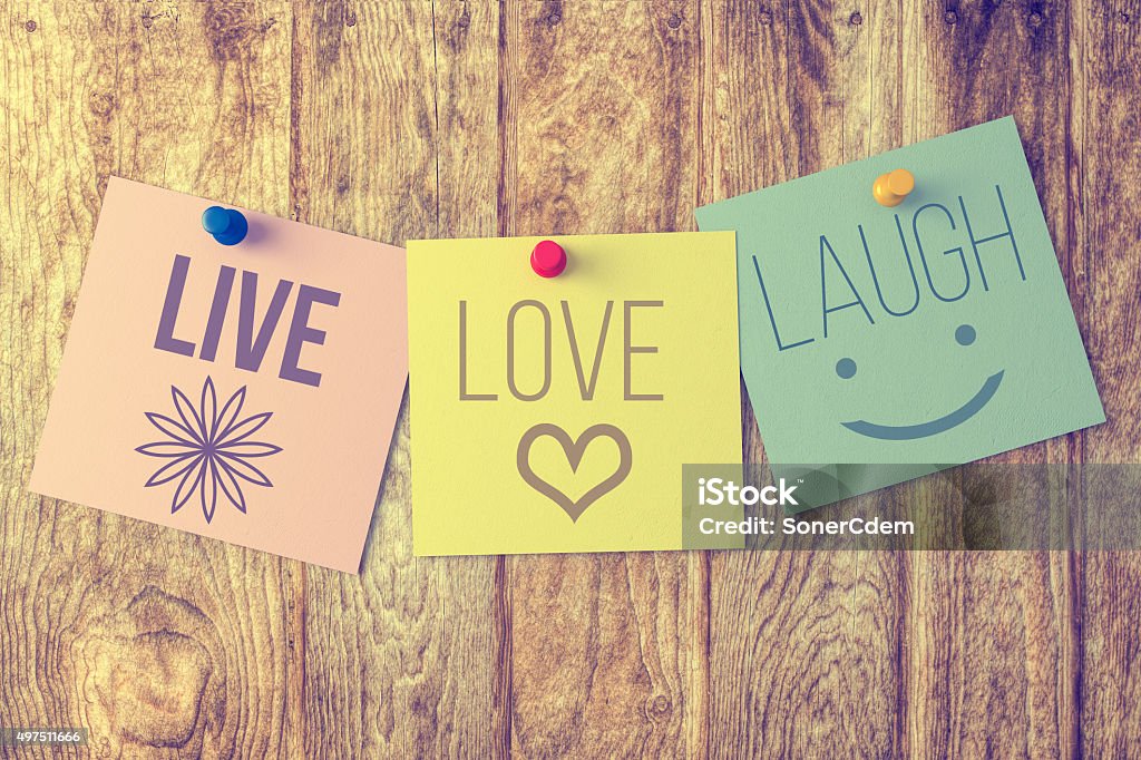 Live laugh love on wooden background Positive Emotion Stock Photo