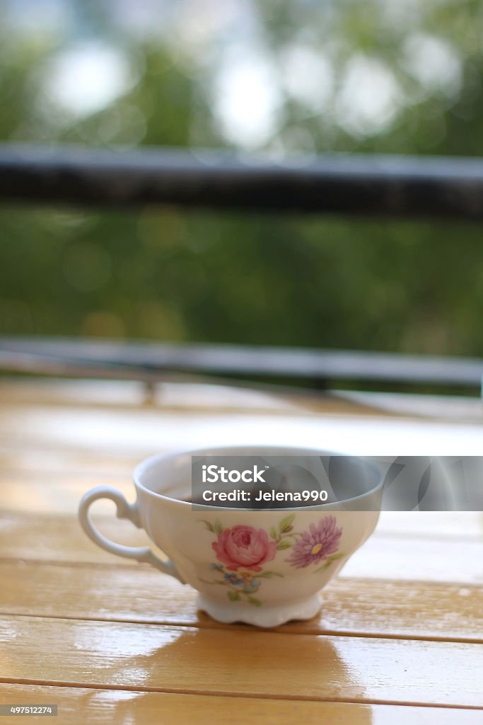 Coffee Coffee in a small vintage porcelain cup, on a terrace. Selective focus. 2015 Stock Photo