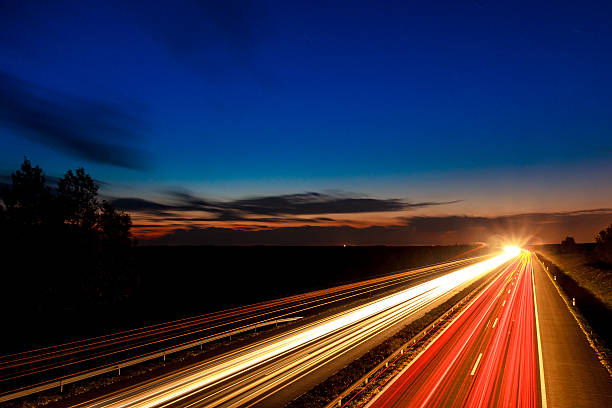 istock Cars speeding on a highway 497512339