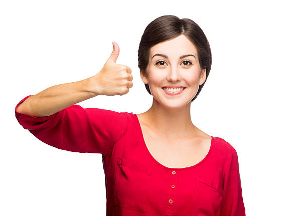 istock Cheerful young woman giving thumbs up 497512807