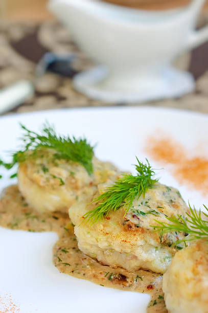 istock Meatballs served in a dill sauce on a white plate. 497513004