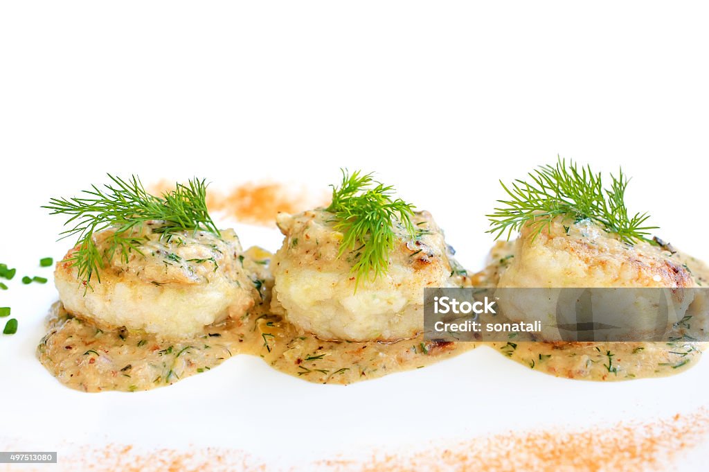 Meatballs served in a dill sauce on a white plate. 2015 Stock Photo