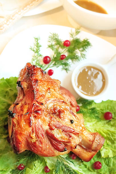 istock Pork knuckle baked with spicy and mustard sauce. 497513168