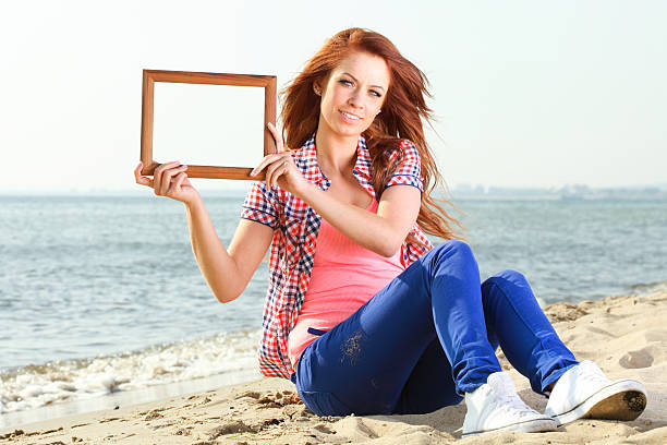 istock Woman Holding Frame travel concept 497513418