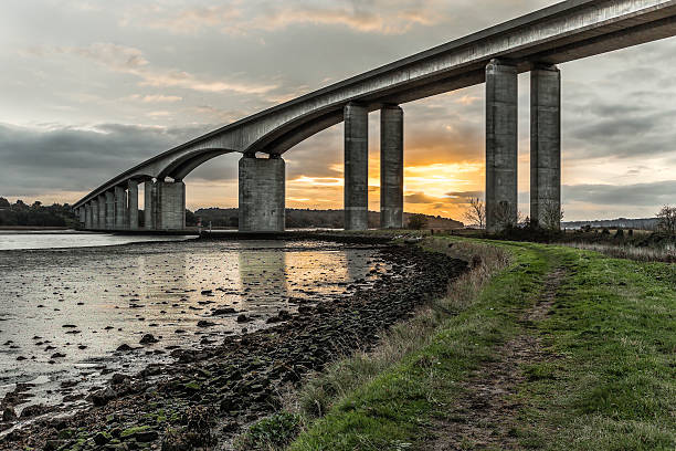 Orwell bridge Sunrise Looking at the sunrise in mid autumn from the amazing structure that is the Orwell bridge in Suffolk uk dibs stock pictures, royalty-free photos & images