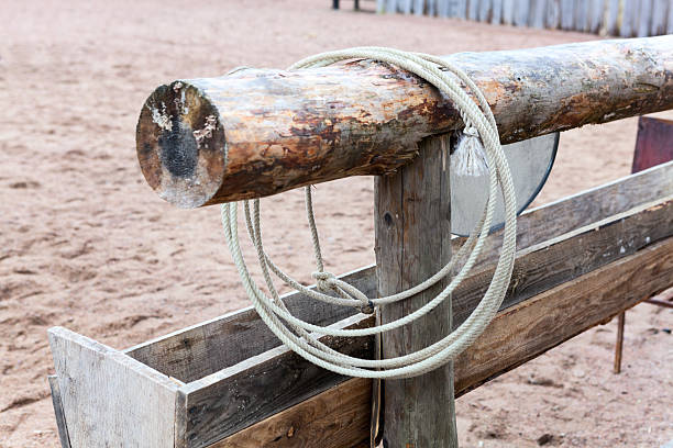 istock Cowboy lasso hanging on timber in western town 497514623