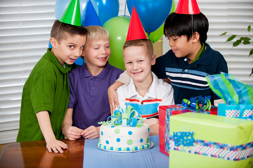 A boy celebrates his birthday with friends.