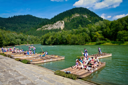 Szczawnica, Poland - August 17, 2011: The river tour across Dunajec gorge. Raftmens and turists sitting on special rafts and admiring beauty of Pieniński National Park in unusual and fascinating way. The river tour lasts from 2 to 3 hours.